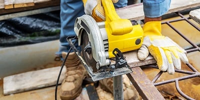 2-27-21-bigstock-Carpenter-Using-Circular-Saw-F-372526318